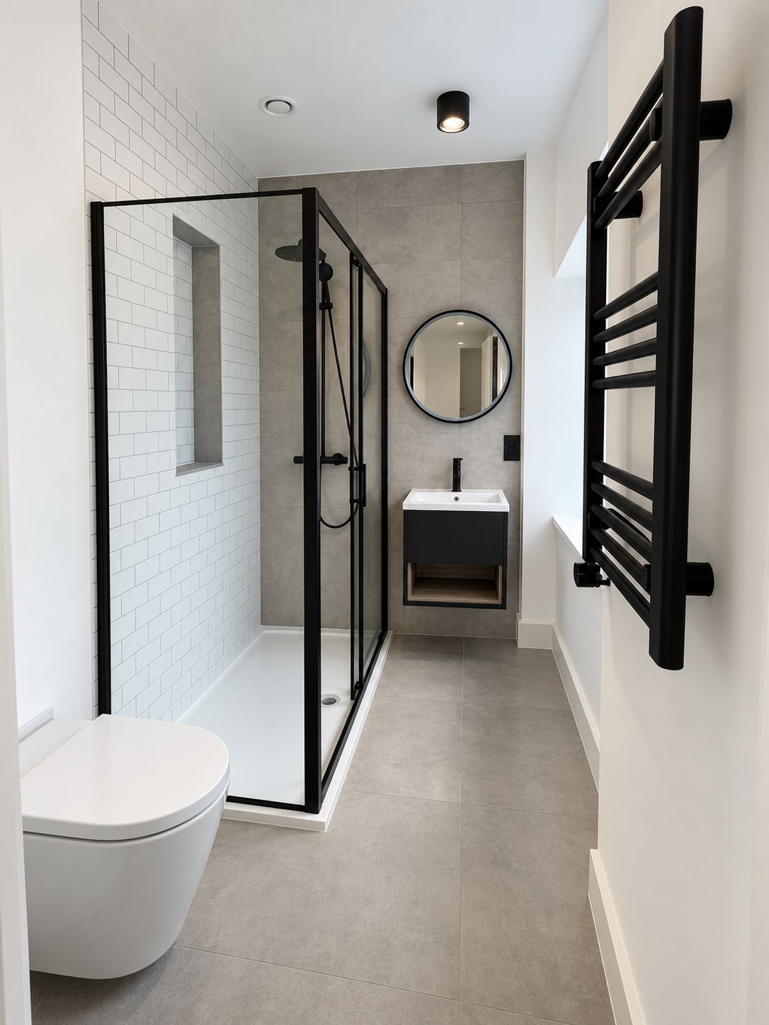 Shower room in matt black and stone-grey tile.